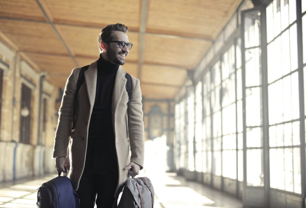 pexels-photo-837129 Man in Brown Robe Carrying Bag Smiling
